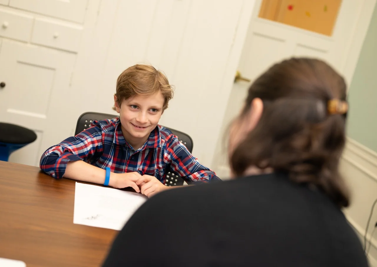 boy working with teacher